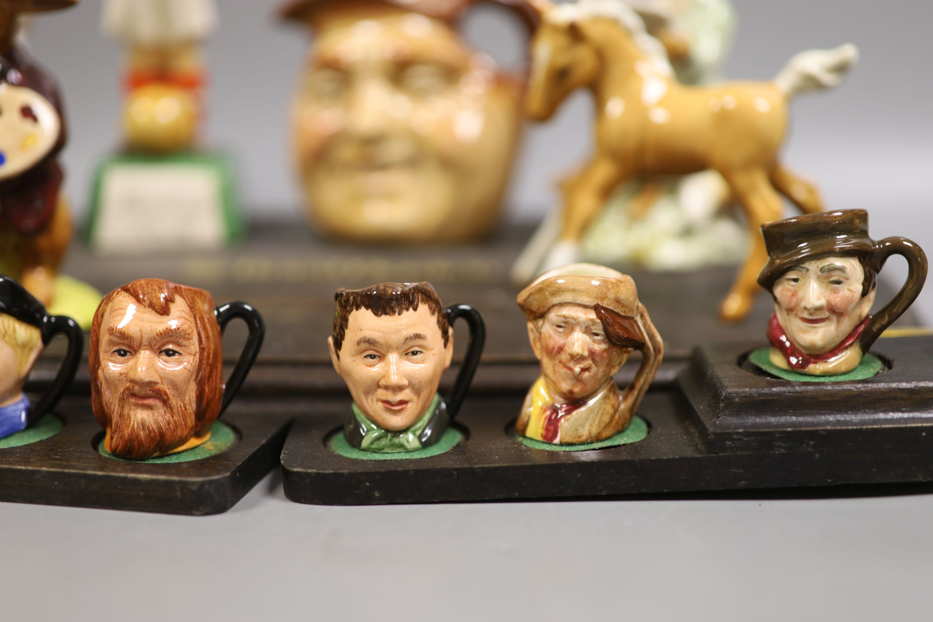 A collection of Royal Doulton miniature character mugs, figurines, series plate etc